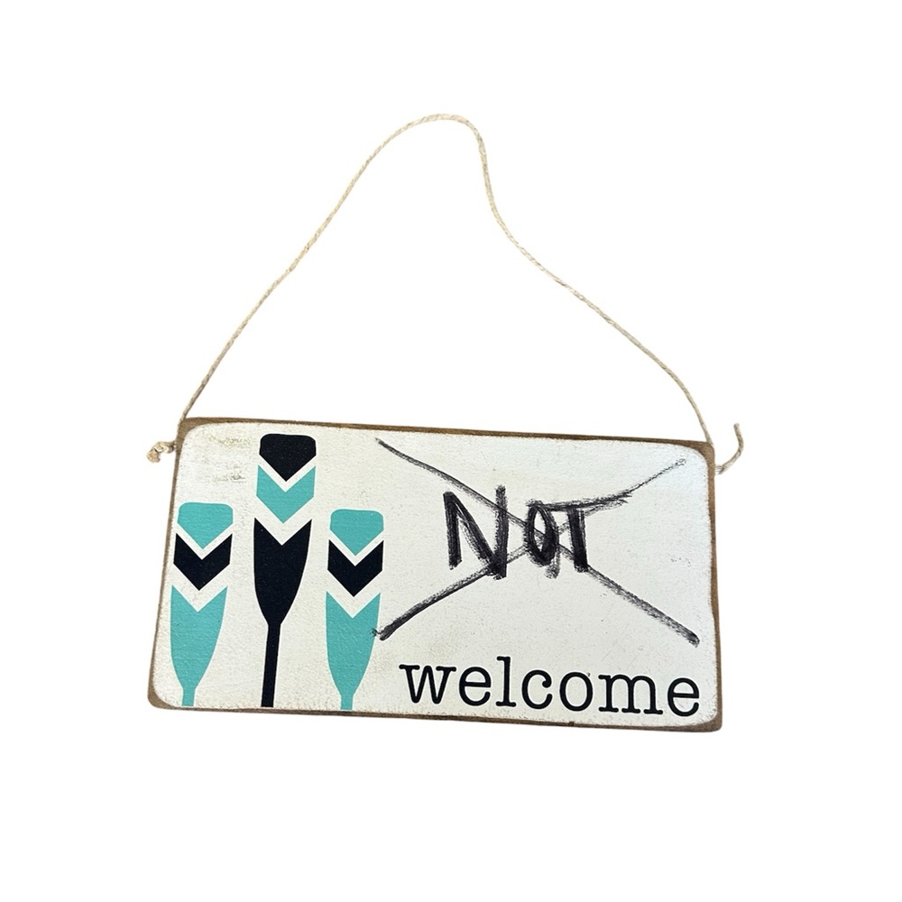 Humorous 'Not Welcome' Sign with Paddles